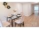 Dining room with stylish decor and view of kitchen at 80 Sumner Nw Ave, Concord, NC 28027