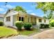 Charming single story home featuring wood post accents, classic shutters, and manicured landscaping at 80 Sumner Nw Ave, Concord, NC 28027