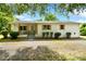 Charming single-story home with a gravel driveway and a welcoming front porch at 80 Sumner Nw Ave, Concord, NC 28027