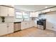 Bright, updated kitchen with stainless steel appliances and granite countertops at 80 Sumner Nw Ave, Concord, NC 28027