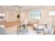 Open-concept living room with contemporary furnishings, wood flooring, and lots of sunlight at 80 Sumner Nw Ave, Concord, NC 28027