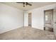 Spacious bedroom with a walk-in closet featuring neutral walls and lots of natural light at 8337 Norcroft Dr, Charlotte, NC 28269