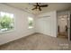 Inviting bedroom with plush carpet, double windows and a spacious closet at 8337 Norcroft Dr, Charlotte, NC 28269