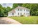 Stunning two-story home featuring a classic brick exterior and lush green lawn at 8337 Norcroft Dr, Charlotte, NC 28269
