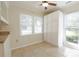 Eat-in kitchen area features large windows offering natural light, and updated cabinetry at 8829 Gelligum Dr, Charlotte, NC 28277