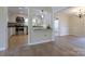 Charming kitchen with granite countertops, stainless steel appliances, and an open view into the dining area at 8829 Gelligum Dr, Charlotte, NC 28277
