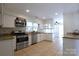 Bright kitchen featuring granite countertops, stainless steel appliances and ample cabinet space at 8829 Gelligum Dr, Charlotte, NC 28277