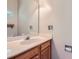 Bathroom features wood vanity, large mirror, laminate countertop, and neutral paint at 8909 Elkins Park Dr, Matthews, NC 28105