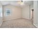 Large bedroom offers neutral paint, carpet floors, and great natural light at 8909 Elkins Park Dr, Matthews, NC 28105