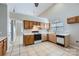 Functional kitchen with white countertops, and wooden cabinets at 8909 Elkins Park Dr, Matthews, NC 28105