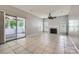 Open concept living room boasts tile flooring, a fireplace, neutral paint, and outdoor access at 8909 Elkins Park Dr, Matthews, NC 28105