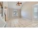 Bright living room with tile floors, vaulted ceiling, and a large window at 8909 Elkins Park Dr, Matthews, NC 28105