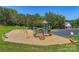 Community playground featuring a variety of slides and climbing structures on a wood chip surface at 8909 Elkins Park Dr, Matthews, NC 28105