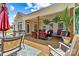 Inviting covered back porch with comfortable seating, ceiling fan, and wooden deck, perfect for outdoor relaxation at 1036 Foreman Ct, Denver, NC 28037