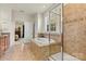 A bathroom features a soaking tub with tile surround, and a glass-enclosed shower at 1036 Foreman Ct, Denver, NC 28037