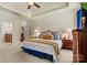 A primary bedroom features a tray ceiling, neutral tones, and an en suite bathroom at 1036 Foreman Ct, Denver, NC 28037