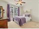 A secondary bedroom featuring natural light from the window and a metal bed frame at 1036 Foreman Ct, Denver, NC 28037