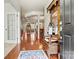 Inviting foyer with hardwood floors, an antique hall tree, and views into the living spaces at 1036 Foreman Ct, Denver, NC 28037