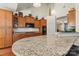 Gourmet kitchen featuring granite countertops, wood cabinets, and high-end appliances at 1036 Foreman Ct, Denver, NC 28037