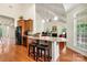 Open kitchen with a breakfast bar, granite countertops, and views into the living room at 1036 Foreman Ct, Denver, NC 28037
