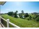 Scenic backyard view showcasing a tranquil pond and manicured landscaping, creating a serene outdoor setting at 108 Augusta Ln, Shelby, NC 28150