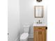 Compact bathroom with a classic design featuring a toilet, vanity, and patterned tile flooring at 108 Augusta Ln, Shelby, NC 28150