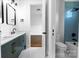 Stylish bathroom featuring a double vanity, blue tile accents, and modern fixtures, offers a spa-like experience at 108 Augusta Ln, Shelby, NC 28150
