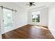 Spacious bedroom with hardwood floors and sliding barn door, offering a modern and stylish design at 108 Augusta Ln, Shelby, NC 28150