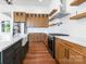 Contemporary kitchen featuring a farmhouse sink, stainless steel appliances, and natural wood cabinets at 108 Augusta Ln, Shelby, NC 28150