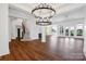 Open living room with high ceilings, hardwood floors, modern lighting and large windows offering scenic views at 108 Augusta Ln, Shelby, NC 28150