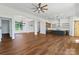 Spacious living room with wood floors, modern lighting, and an open concept kitchen, perfect for entertaining at 108 Augusta Ln, Shelby, NC 28150