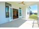Inviting covered patio with an open doorway to the main living area and views of a lush green lawn at 108 Augusta Ln, Shelby, NC 28150