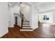 Elegant staircase featuring hardwood steps and a modern railing leading to the upper level of the home at 108 Augusta Ln, Shelby, NC 28150