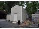 A tan shed, perfect for storage or workshop, sits beside a gray gravel area at 114 Redwood Trl, Mount Gilead, NC 27306