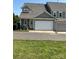 Spacious two-car garage with white door and neutral colored exterior at 11608 Founders Park Ln, Pineville, NC 28134