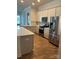 Modern kitchen featuring stainless steel appliances and an island at 11608 Founders Park Ln, Pineville, NC 28134