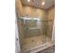 Bathroom featuring a modern glass door shower with tile surround and overhead shower head at 11608 Founders Park Ln, Pineville, NC 28134