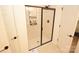 Modern bathroom featuring a glass-enclosed shower with white subway tile, and neutral-toned tile floor at 12209 Riceland Way, Midland, NC 28107