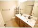 Bathroom featuring double sinks, a large mirror, and a shower-tub combination at 12209 Riceland Way, Midland, NC 28107