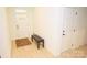 Bright entryway featuring neutral walls, tiled floors, and a stylish bench seating, creating a welcoming ambiance at 12209 Riceland Way, Midland, NC 28107