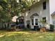 Backyard with a deck, patio furniture, grill, mature trees and well-manicured landscaping at 12623 Levins Hall Rd, Huntersville, NC 28078