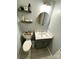 Powder room with stylish decor, light blue walls, and tile flooring at 12623 Levins Hall Rd, Huntersville, NC 28078