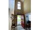 Bright entryway featuring a red front door, coat rack, and natural light streaming through the window at 12623 Levins Hall Rd, Huntersville, NC 28078