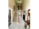 Welcoming two-story foyer with a staircase, tile flooring, and view into the living room at 12623 Levins Hall Rd, Huntersville, NC 28078