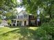 Charming two-story home with a welcoming front porch and well-maintained lawn at 12623 Levins Hall Rd, Huntersville, NC 28078