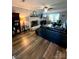 Spacious living room with hardwood floors, a fireplace, and ample natural light at 12623 Levins Hall Rd, Huntersville, NC 28078