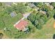 Aerial view of a luxurious home with a swimming pool and well-manicured landscaping surrounded by lush greenery at 149 Vista Bluff Ln, Mooresville, NC 28117