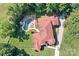 Stunning aerial view of estate with pool, lush landscaping, and a distinctive red-tiled roof at 149 Vista Bluff Ln, Mooresville, NC 28117