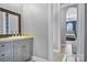 Neutral bathroom with a single sink vanity, stone countertop and views to bedroom at 149 Vista Bluff Ln, Mooresville, NC 28117