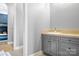 Bathroom vanity features shaker cabinets, a tiled countertop and a wall mirror at 149 Vista Bluff Ln, Mooresville, NC 28117